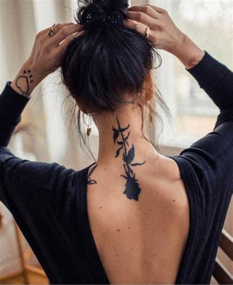 ladies tattoos back neck|female back of neck tattoo.